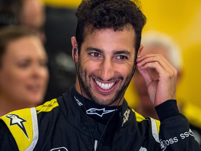 Renault's Australian driver Daniel Ricciardo rests in the paddock during the third practice session ahead of the Formula One Bahrain Grand Prix at the Sakhir circuit in the desert south of the Bahraini capital Manama, on March 30, 2019. - The Formula One Bahrain Grand Prix will be held on March 31. (Photo by Andrej ISAKOVIC / AFP)