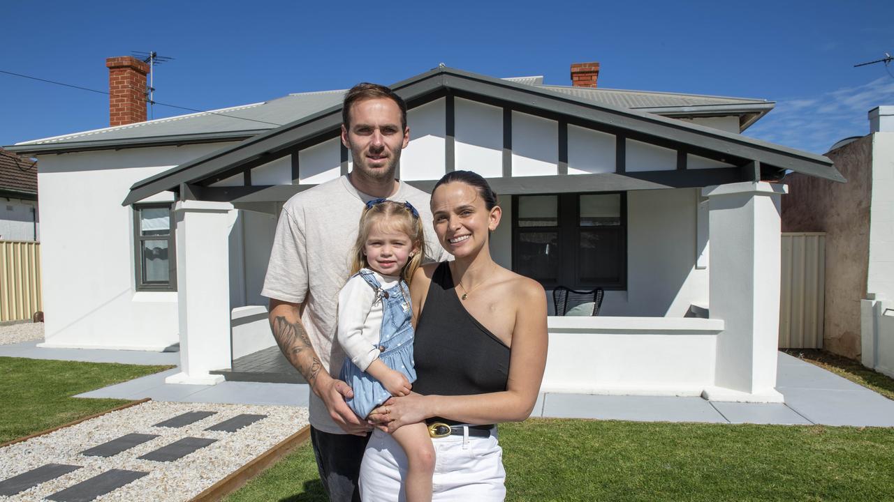 Kellie and Jeremy Finlayson with their daughter Sophia in their Hendon home they are selling. Picture: Mark Brake