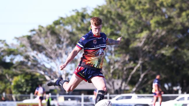 Runaway Bay's Guy Hamilton in action against Burleigh during their Rugby League match at Pizzey Park on the Gold Coast. Photograph : Jason O'Brien