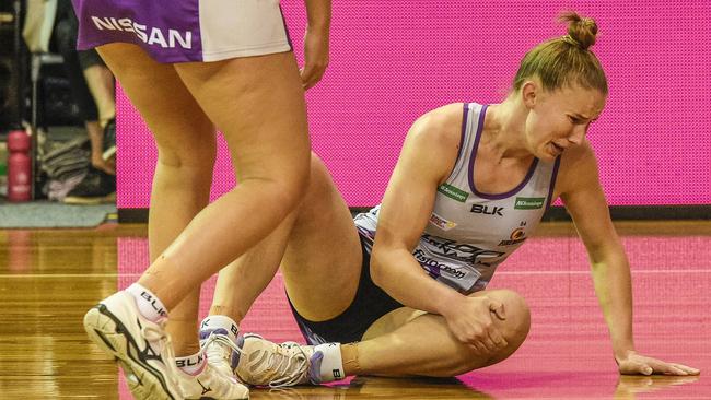 Mahalia Cassidy grabs her knee in agony. Picture: AAP Image/Roy VanDerVegt