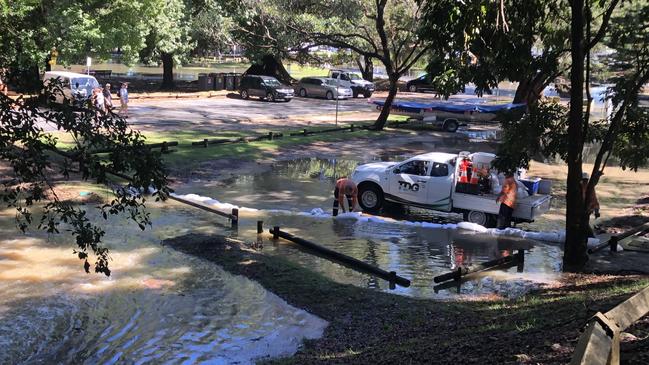 A Sydney Water emergency crew work at Clontarf Reserve on Saturday morning to divert wastewater overflowing from a major sewage pipe across Middle Harbour, near the Clontarf sewerage pumping station, from flowing into the carpark. Picture: Jim O’Rourke