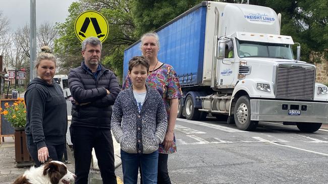 Hahndorf locals Catherine McLeod, with her dog Hunter, Jeremy Roberts, Cathryn Nitschke and son Solomon Nitschke in the Main Street. Picture: Dylan Hogarth