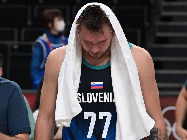 Slovenia's Luka Doncic walks off the court after losing in the men's semi-final basketball match between France and Slovenia during the Tokyo 2020 Olympic Games at the Saitama Super Arena in Saitama on August 5, 2021. (Photo by Aris MESSINIS / AFP)