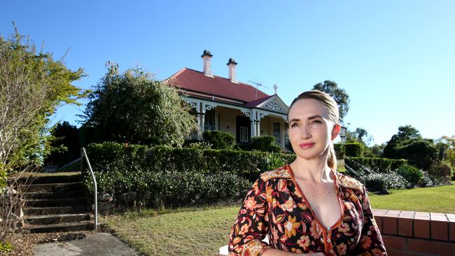 Rebecca Kenny and other Toowong residents have had a win in their fight to save the sweeping grounds of heritage-listed Goldicott House from unit development. Picture: AAP/Renae Droop