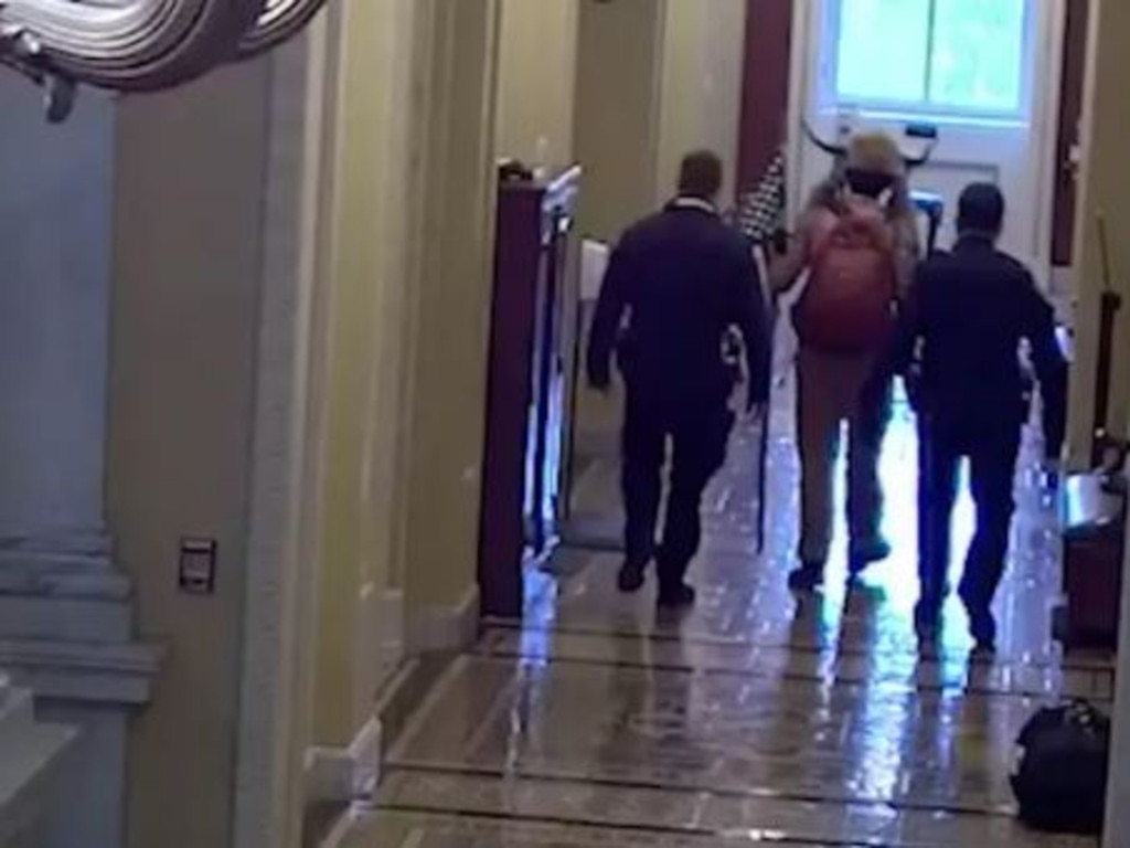 January Footage Shows Capitol Cops Escorting QAnon Shaman To Senate Floor News Com Au