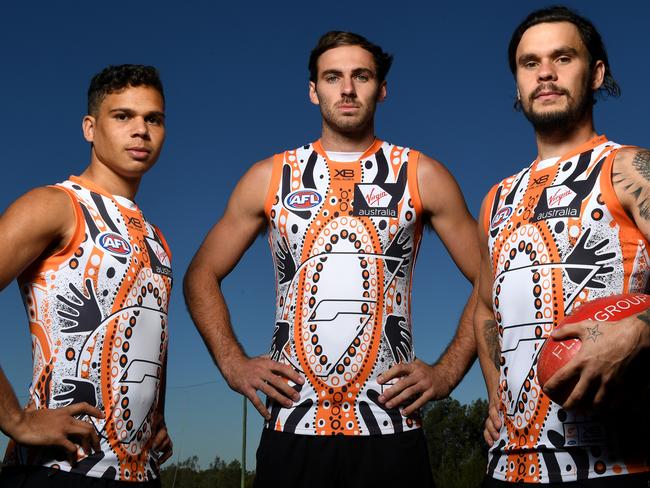 (L-R) GWS Giants players Ian ÒBobbyÓ Hill, Jeremy Finlayson and Zac Williams pose for a photograph in the club's indigenous jumper, ahead of Indigenous Round, in Sydney, Tuesday, May 28, 2019. (AAP Image/Dan Himbrechts) NO ARCHIVING, EDITORIAL USE ONLY