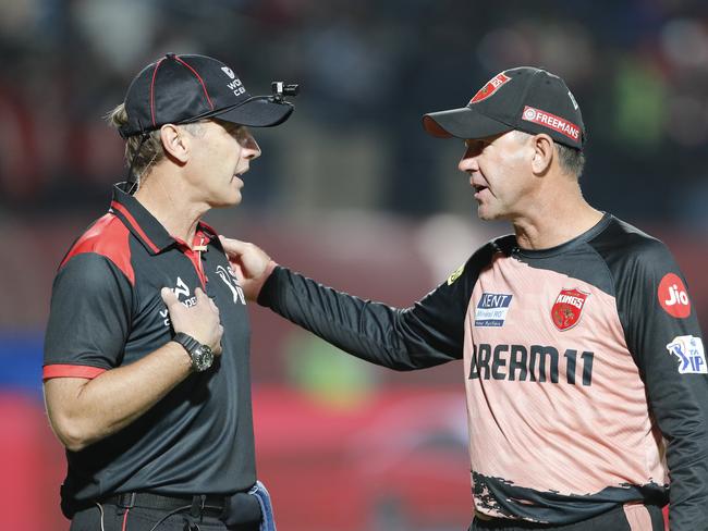 Punjab Kings’ head coach Ricky Ponting (R) chats with a match official. Picture: Getty