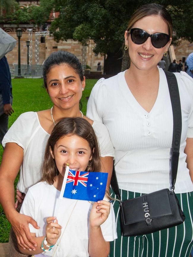 Thousands of people have braved the rain to gather in Brisbane for Anzac Day services. Picture: Grace Kessels
