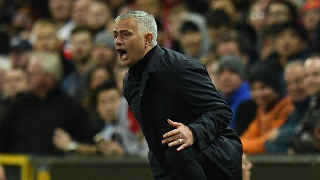 Manchester United's Portuguese manager Jose Mourinho gestures during the English Premier League football match between Manchester United and Newcastle at Old Trafford in Manchester, north west England, on October 6, 2018. (Photo by Oli SCARFF / AFP) / RESTRICTED TO EDITORIAL USE. No use with unauthorized audio, video, data, fixture lists, club/league logos or 'live' services. Online in-match use limited to 120 images. An additional 40 images may be used in extra time. No video emulation. Social media in-match use limited to 120 images. An additional 40 images may be used in extra time. No use in betting publications, games or single club/league/player publications. /