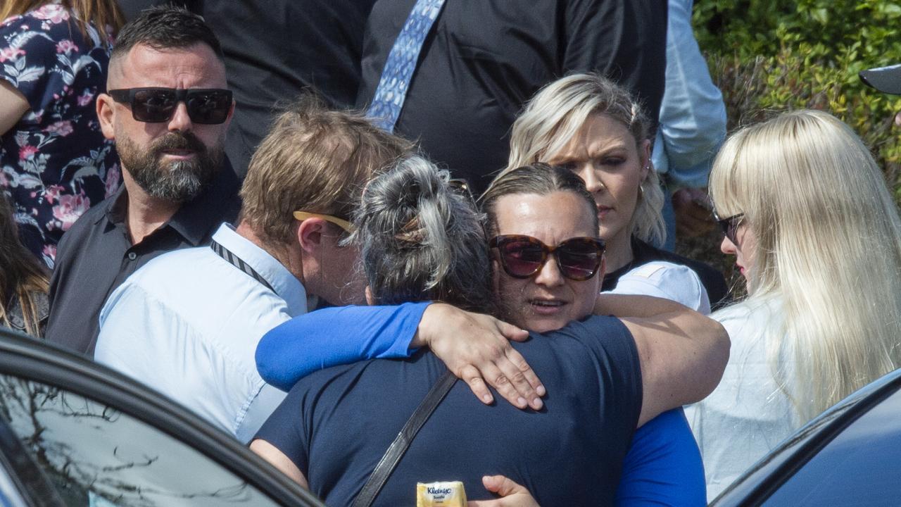 Mourners embracing at Gabby’s funeral. Picture: NCA NewsWire / Monique Harmer