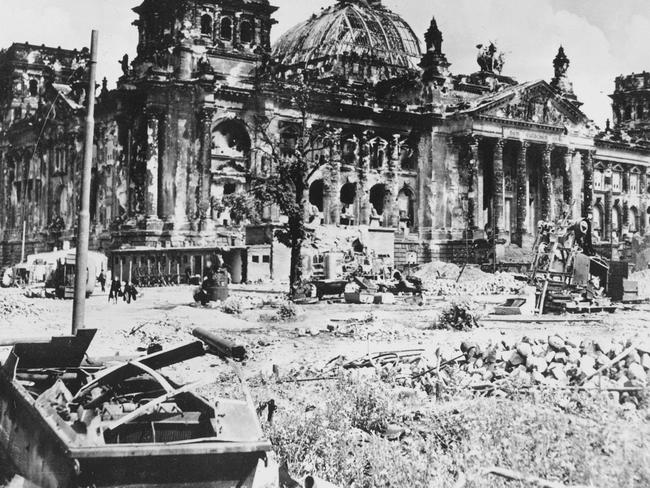 In this file picture from 1945, the wreckage of the Reichstag building is seen at the end of World War II (Two), in Berlin, Germany, with a destroyed German military vehicle in foreground. Picture: Ap