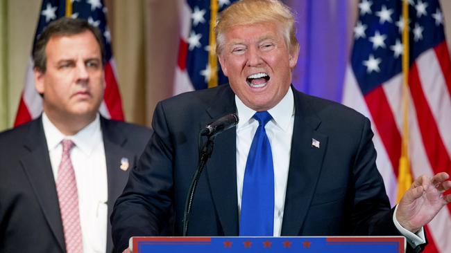 Donald Trump during his victory speech. With Chris Christie looking sad in the background.