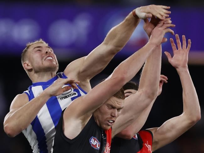 MELBOURNE, AUSTRALIA - AUGUST 12: Ben McKay of the Kangaroos competes with Peter Wright of the Bombers  during the round 22 AFL match between North Melbourne Kangaroos and Essendon Bombers at Marvel Stadium, on August 12, 2023, in Melbourne, Australia. (Photo by Darrian Traynor/Getty Images)