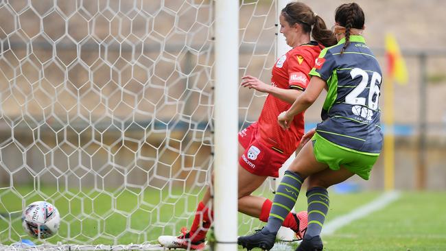 Emily Condon bundles home a late consolation for Adelaide United in its loss to Canberra United at Marden. Picture: Mark Brake/Getty Images