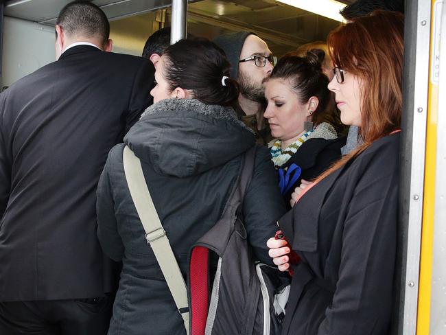 People attempting to board the 8.18am train at Macdonaldtown station.