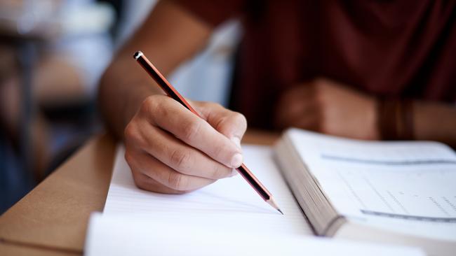 Close up of hands of a student during an exam. Picture: istock