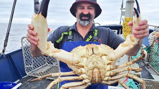 Brendan 'Squizzy' Taylor long time fisherman and of TV show Aussie Lobster Men with the giant crab he caught in North West Tasmania.  Picture: Brendan 'Squizzy' Taylor