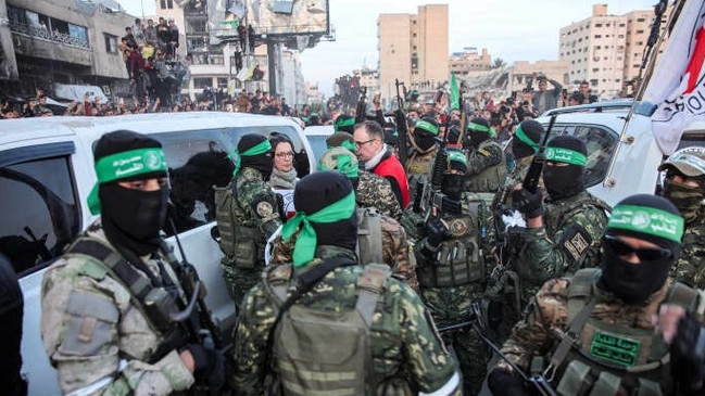 Red Cross personnel spoke with Hamas members in Gaza City this month during the first release of hostages under the ceasefire deal. Picture: Omar Al-Qattaa/AFP/Getty Images