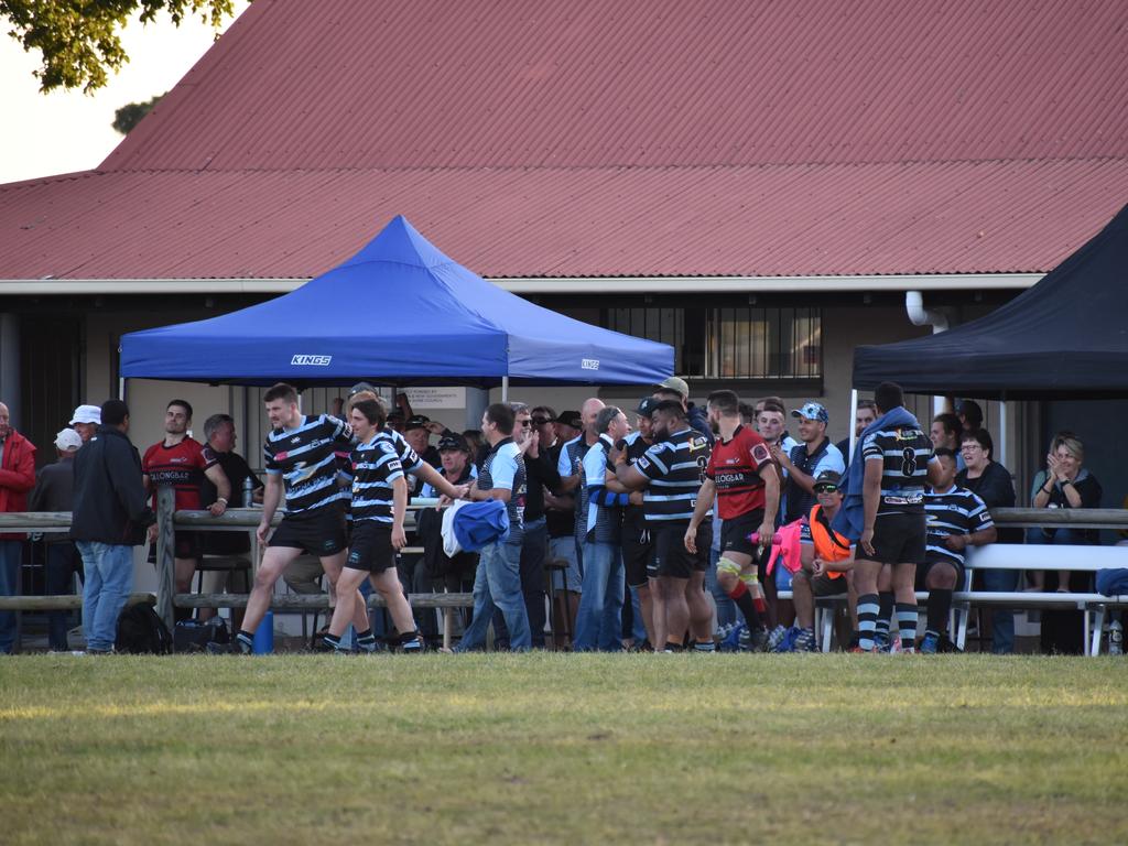 Ballina players celebrate winning the Dane Cupitt shield after the game.