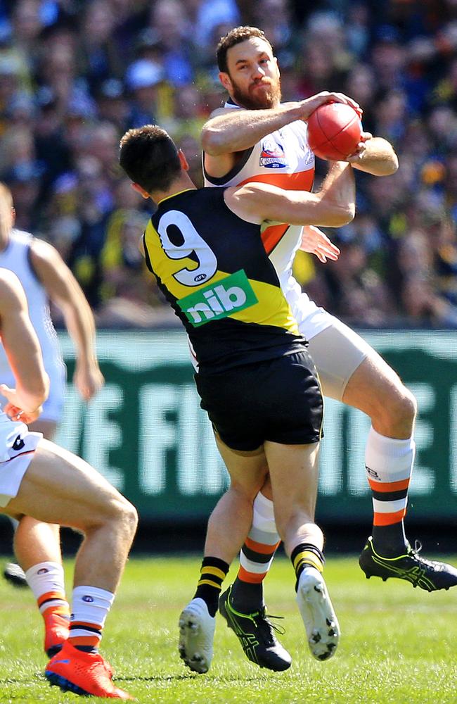 Cotchin wraps up Shane Mumford. Picture: Mark Stewart