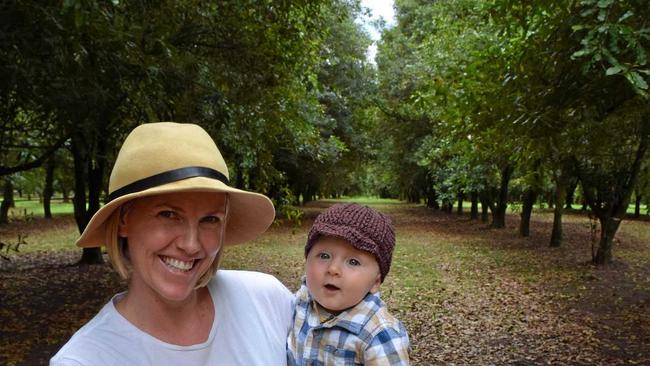 Barenuts Macadamia owner Jodie Cameron with six-month-old Ari in the Bauple Nut plantation. Picture: Boni Holmes