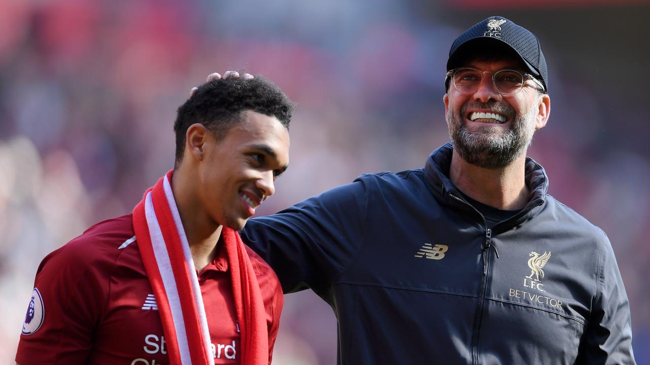 Jurgen Klopp, Manager of Liverpool embraces Trent Alexander-Arnold
