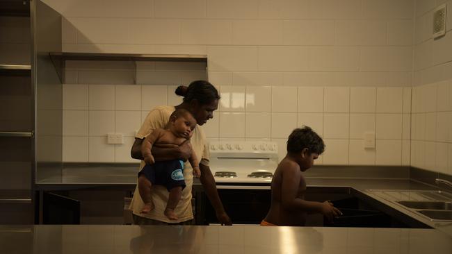 Jenimah and his mum Lucille Papajua inspect their new kitchen. Picture: (A)manda Parkinson