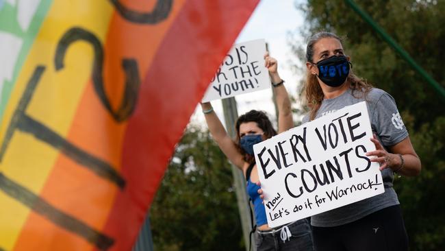 Joe Biden supporters celebrate at Freedom Park in Atlanta, Georgia. Picture: Getty Images/AFP