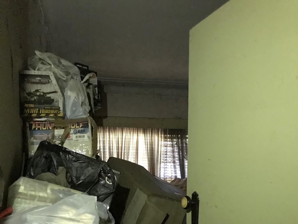 Shane Snellman’s mummified corpse was found among stacks of rubbish inside Bruce Roberts’ home.