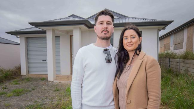 Felmeri customers Sam Carrison and Jessica Harrison outside their unfinished home. Picture: Ben Clark