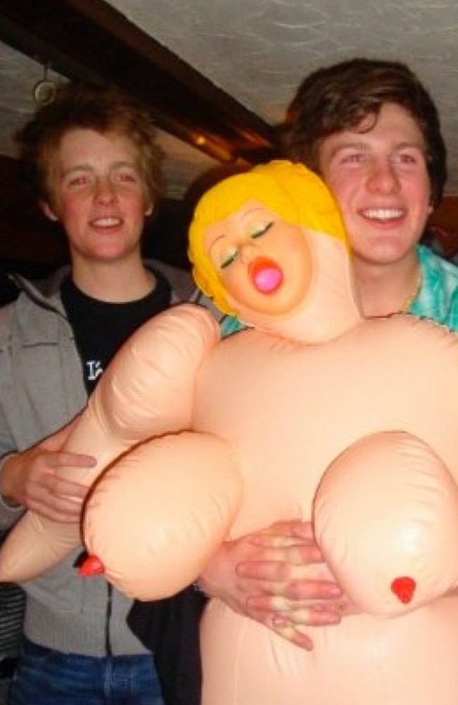 Hugh larking with blow-up doll.