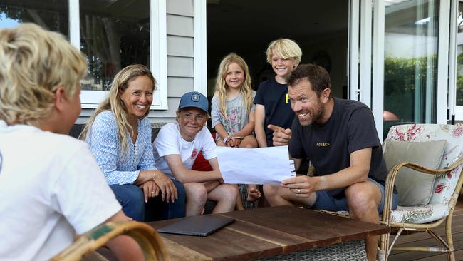 Tim Hodgson and wife Emma discuss a personalised road map to net zero with Barney, 13, Jemima, 7, and Harry, 10. Picture: Jane Dempster