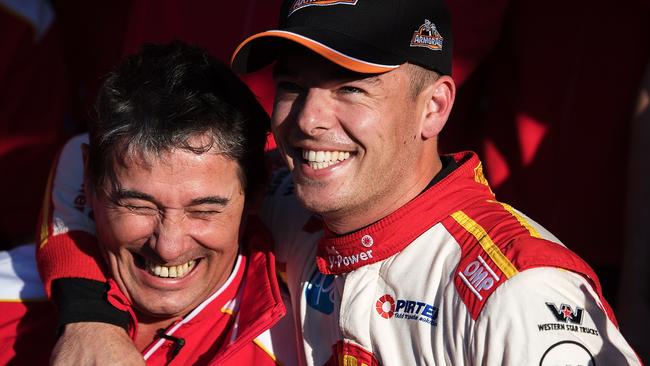 Ford driver Scott McLaughlin (right) celebrates with Ludo Lacroix, engineering director at the Shell V-Power Racing Team after he secured pole for the Bathurst 1000 with the fastest lap in the race’s history.