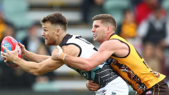 Port Adelaide’s Robbie Gray of the Power is tackled against Hawthorn at University of Tasmania Stadium, Launceston. Picture: Scott Barbour/Getty Images