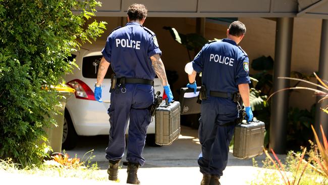 Forensic officers enter Ms Jay’s house where she was attacked. Picture: Nathan Edwards