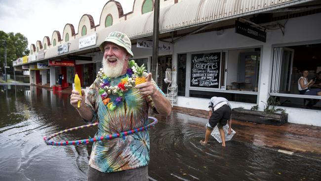 Iconic Byron Bay Busker Koolio entertains people after the flood waters start to subside. Picture: Natalie Grono