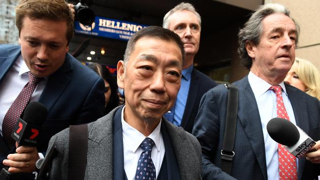 Ernest Wong (centre) leaves the NSW Independent Commission Against Corruption (ICAC) public inquiry into allegations concerning political donations in Sydney in Sydney, Friday, August 30, 2019. (AAP Image/Dean Lewins) NO ARCHIVING