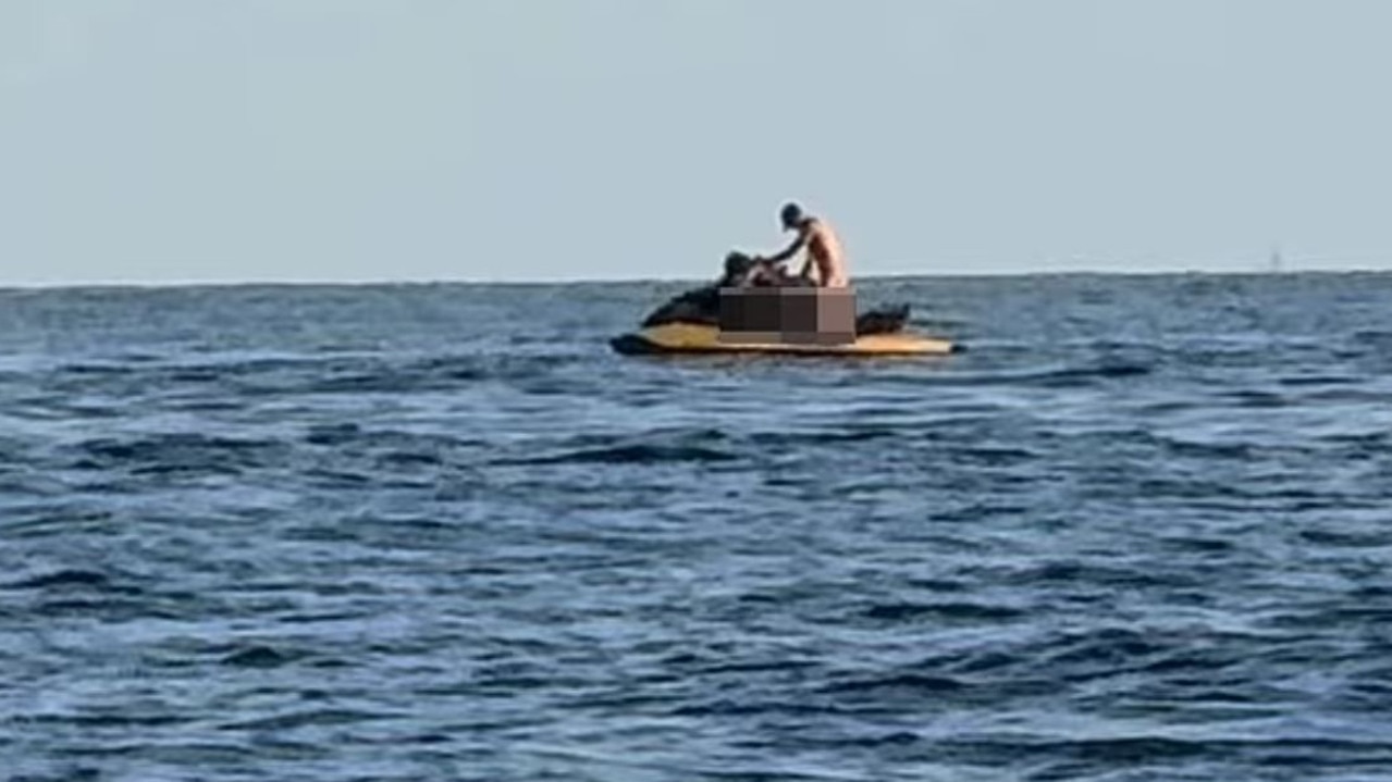 The fellow Jetski rider was captured in an X-rated act.