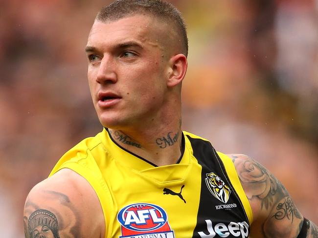 MELBOURNE, AUSTRALIA - SEPTEMBER 30:  Dustin Martin of the Tigers runs the ball during the 2017 AFL Grand Final match between the Adelaide Crows and the Richmond Tigers at Melbourne Cricket Ground on September 30, 2017 in Melbourne, Australia.  (Photo by Cameron Spencer/AFL Media/Getty Images)
