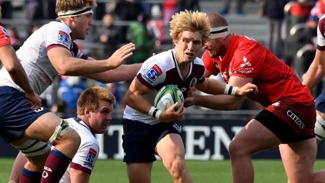 Tate McDermott carries the ball against the Sunwolves. Picture: AFP