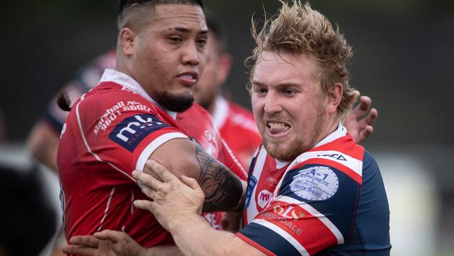 Camden’s Jackson Willis was on fire, East Campbelltown’s Felix Smith looks on.