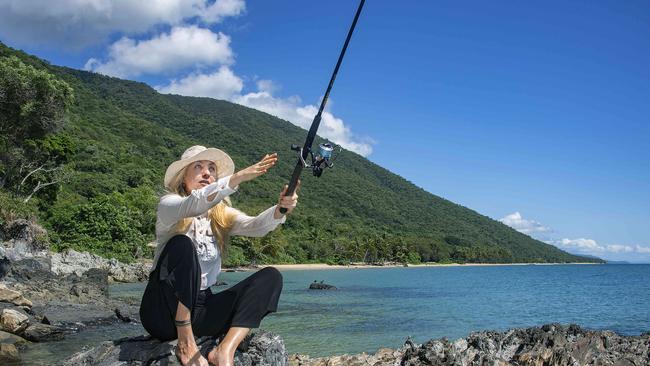 Traveller Svetlana Brecht from Karaganda in Kazakhstan wets a line on an idyllic day at Ellis Beach. Picture: Brian Cassey