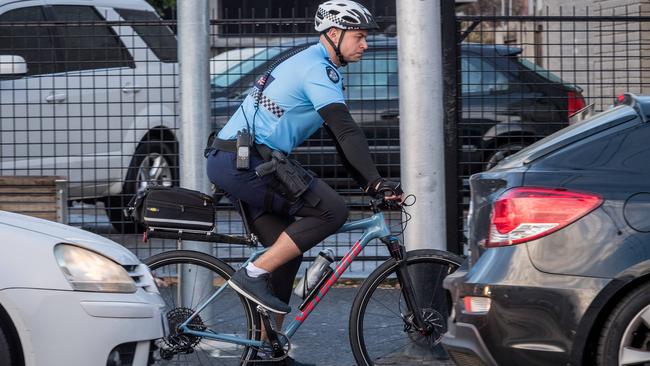 First Constable Chris Plumridge rides along Swan Street while looking for drivers who use their phones. Picture: Jake Nowakowski