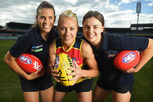 Crows women's players Chelsea Randell, Erin Phillips and Ebony Marinoff, ahead of the announcement of the draw for their first season in 2016. Picture: Tom Huntley