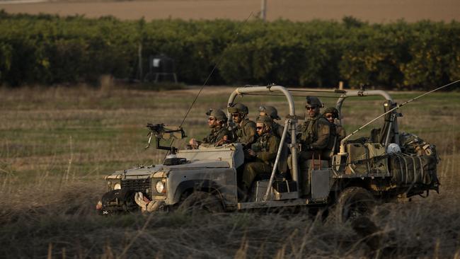 Israeli soldiers drive near the border with the Gaza Strip. Picture: Getty Images