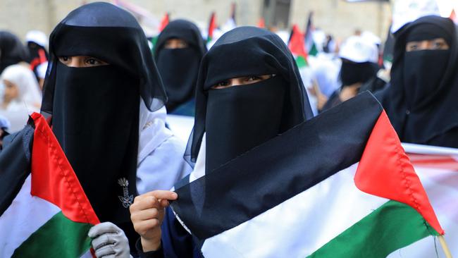 Yemeni women hold up Palestinian flags during a protest in front of the UN office in Sanaa on December 10. Picture: )