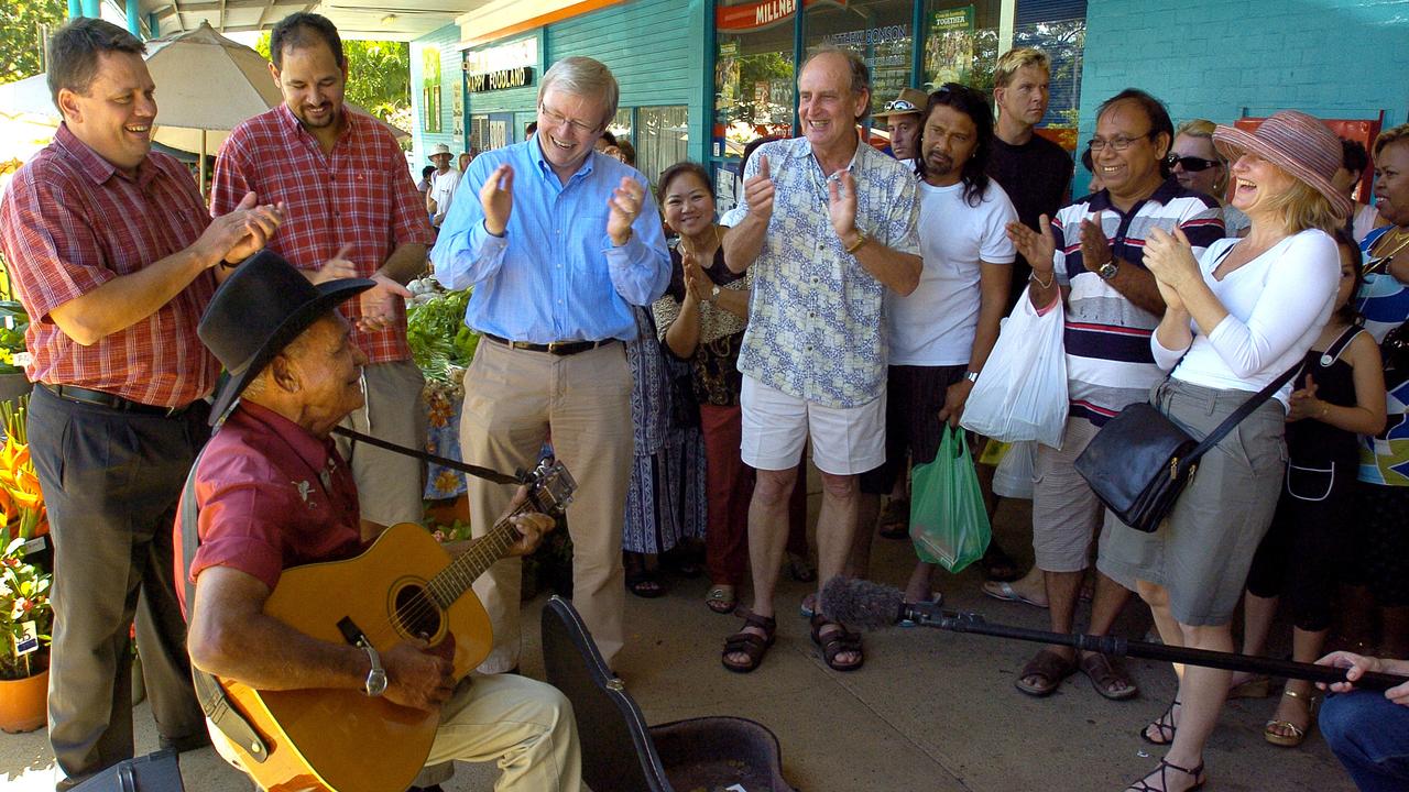 Jimmy Howard entertains Kevin Rudd at Rapid Creek market in Darwin.