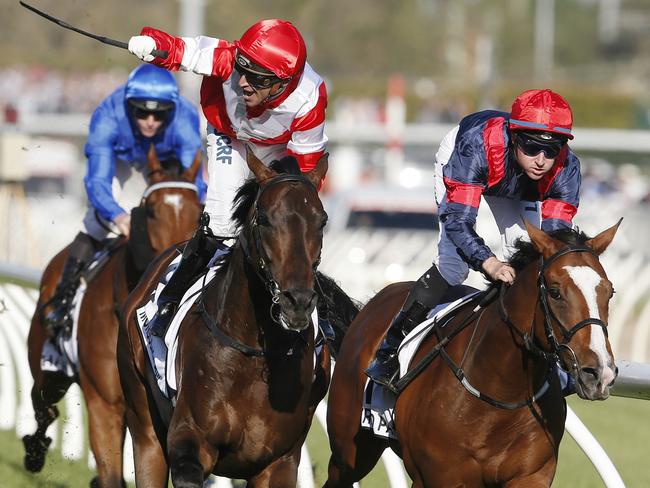 Jockey Opie Bosson celebrates after winning the Caulfield Cup on Mongolian Khan ahead of Trip To Paris. Picture: Michael Klein