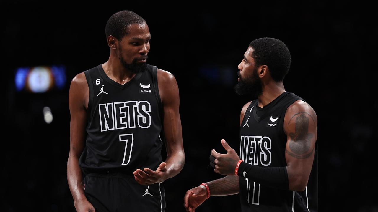 NEW YORK, NEW YORK - OCTOBER 31: Kyrie Irving #11 and Kevin Durant #7 of the Brooklyn Nets talk during a break in the action during the fourth quarter of the game against the Indiana Pacers at Barclays Center on October 31, 2022 in New York City. NOTE TO USER: User expressly acknowledges and agrees that, by downloading and or using this photograph, User is consenting to the terms and conditions of the Getty Images License Agreement. (Photo by Dustin Satloff/Getty Images)