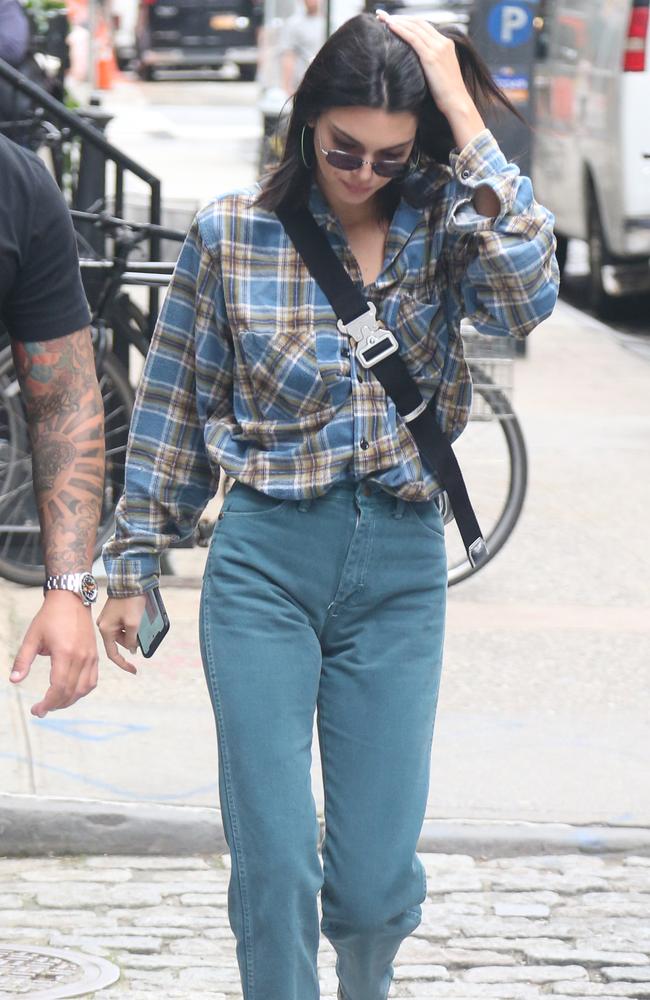 Keeping a low profile! Kendall Jenner dressed down in a check shirt and jeans in the Big Apple. Picture: MEGA TheMegaAgency.com